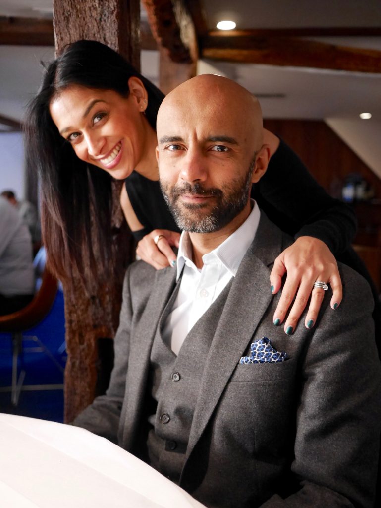 picture of sima with husband in grey suit