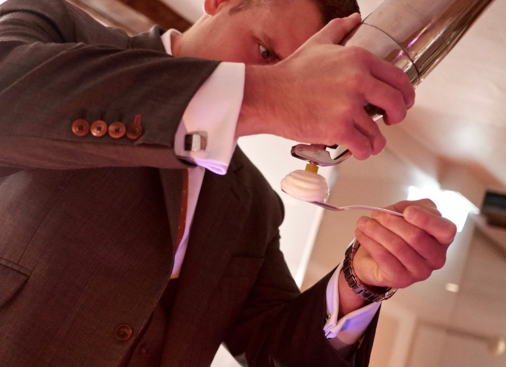 man serving a nitro poached apéritif
