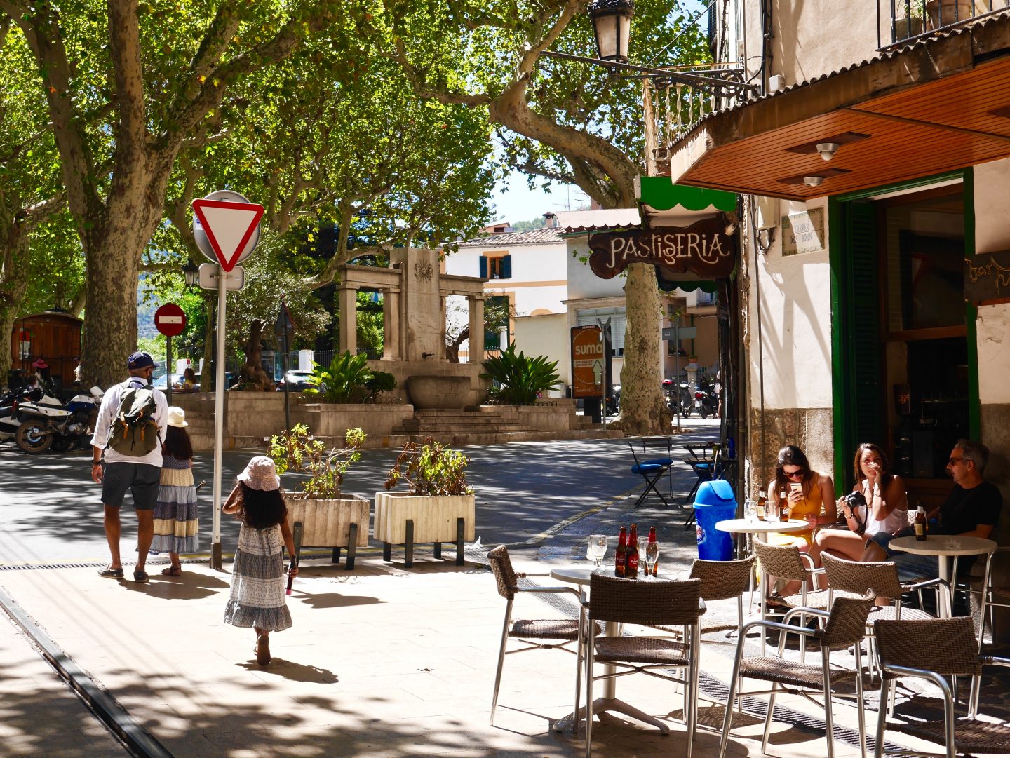view of outside dining and 'patisseria' on. the streets of Placa Constitucid