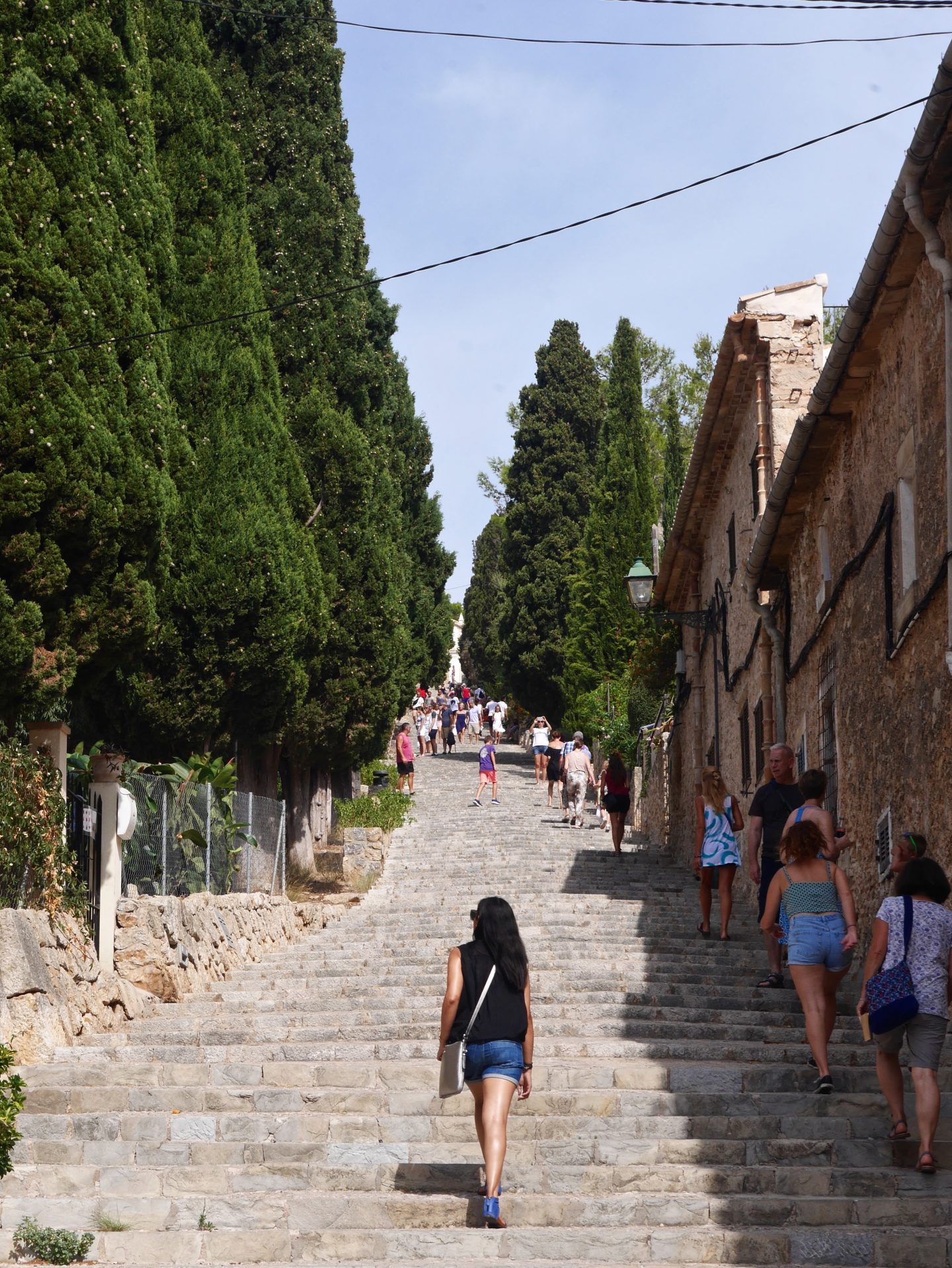 Sima walking up the steps leading up to El Calvari in Mallorca