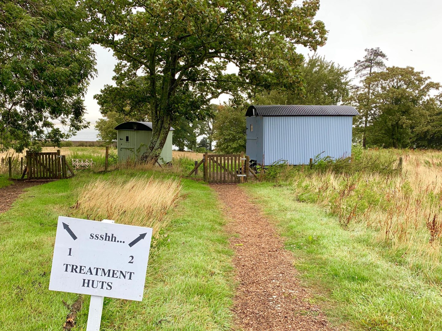 treatment rooms with arrow pointing to huts 1 and 2