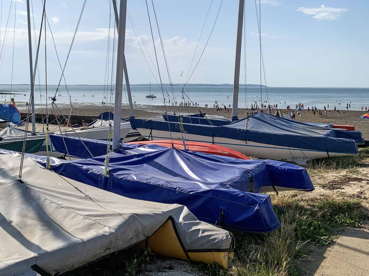 view of covered boats and yachts on the beach of whitstable
