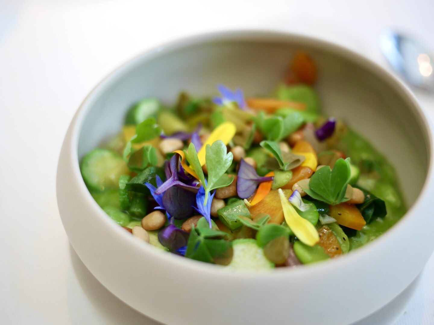 summer vegetable risotto in a white bowl