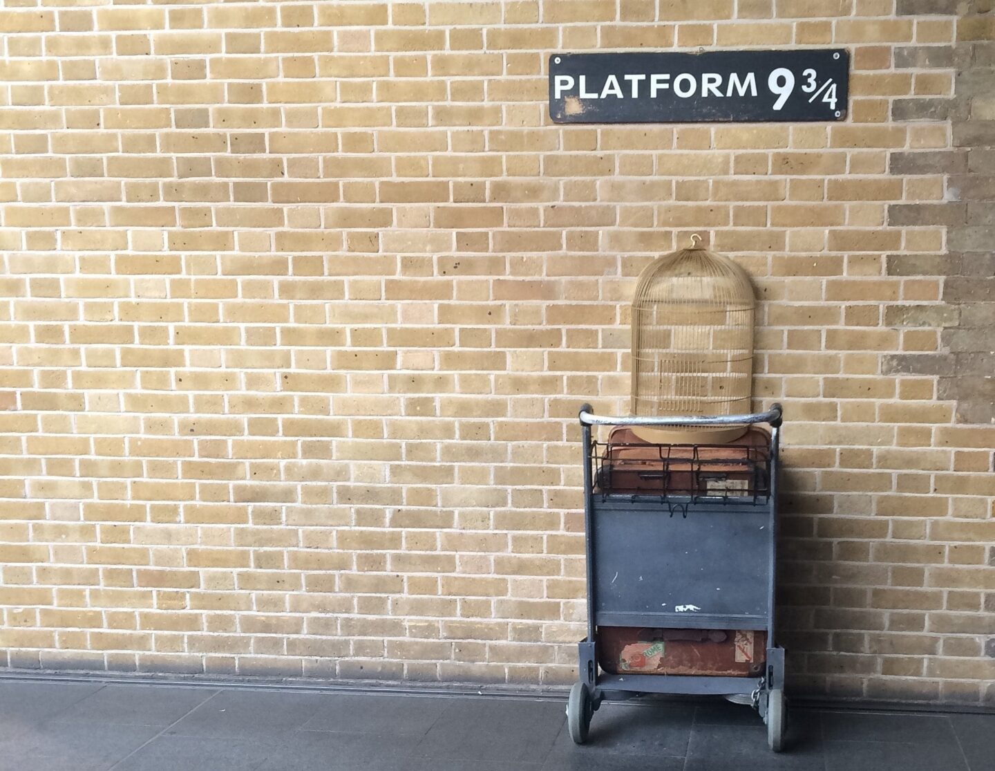 view of the owl cage and trolley half way through the wall at kings cross