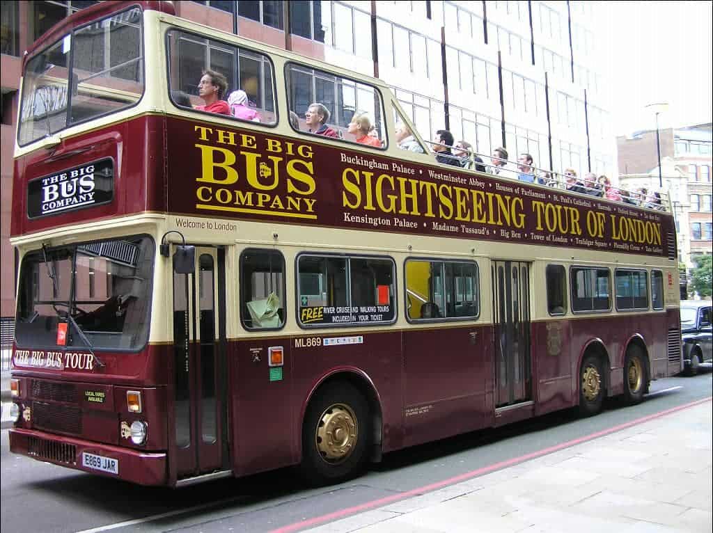 view of a dark red sightseeing bus in London
